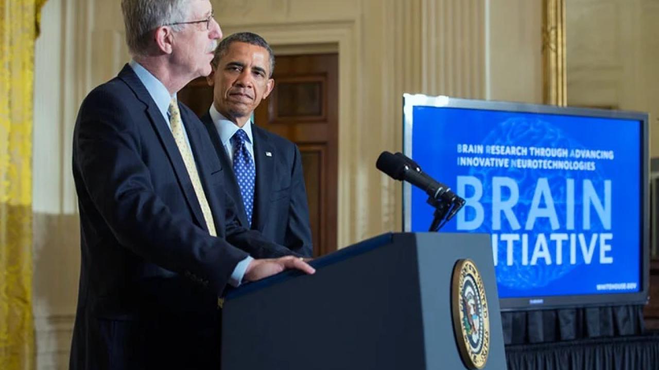 President Barack Obama is introduced by Dr. Francis Collins, Director, National Institutes of Health, at the BRAIN Initiative event in the East Room of the White House, April 2, 2013.
