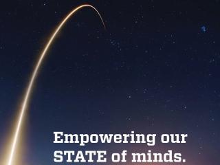 An arc of light, like a comet, in the sky. Text reads "Empowering our state of minds."
